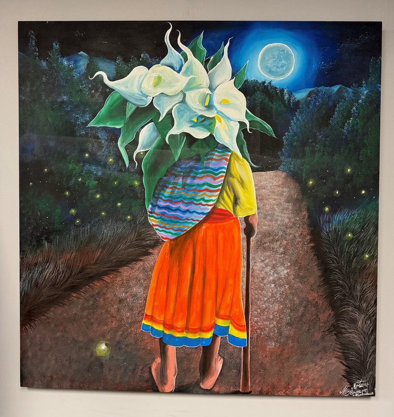 “Abuelita Otomi” depicts a grandmother and is one of three acrylic paintings being exhibited by artist Arturo Morales Morano that react to black light. 
